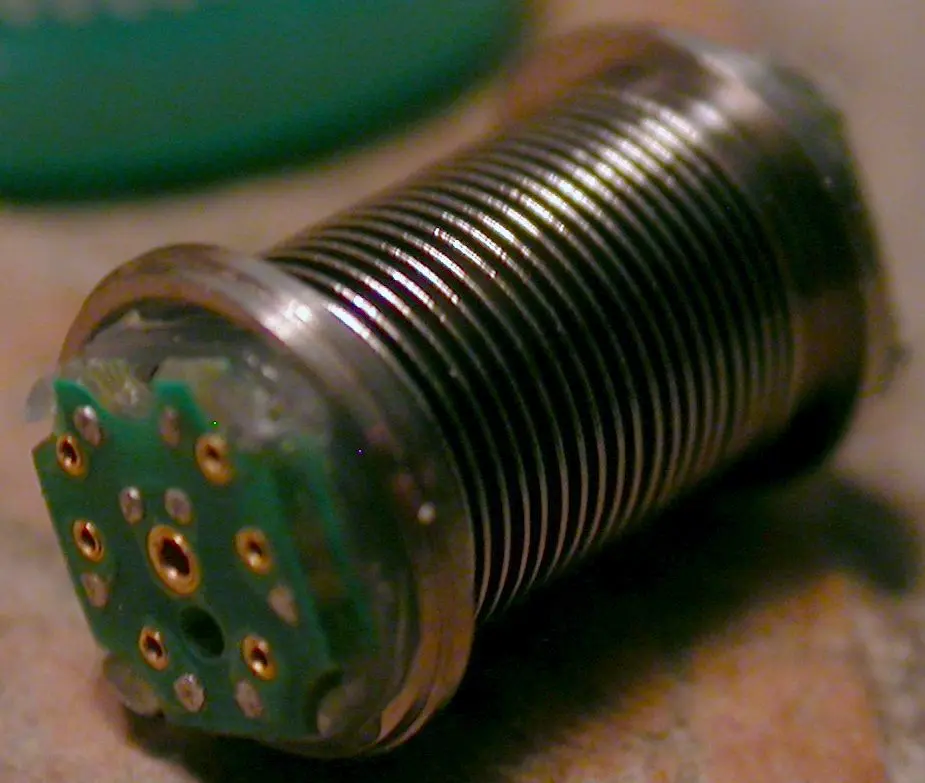 Miniature circular flex coupler mounted inside a titanium bellows