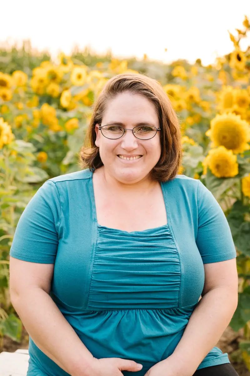 Sarah Fine in a sunflower field